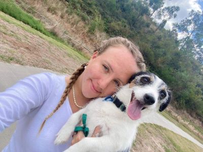 Caitlan holding one of her fur babies in her arms