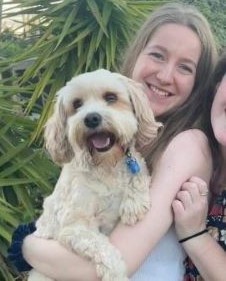 Molly holding one of her fur babies in her arms